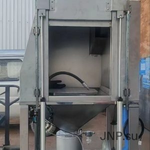 Shot blasting chamber for cleaning the surfaces of parts and assemblies